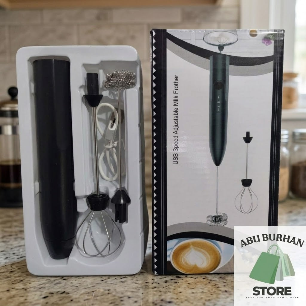 Rechargeable milk frother in an open packaging tray with balloon whisk, coil whisk and USB charging cable
